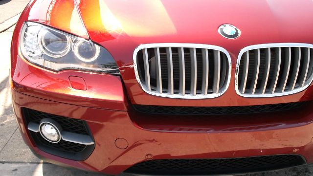 2011 BMW X6 1999 Toyota LE