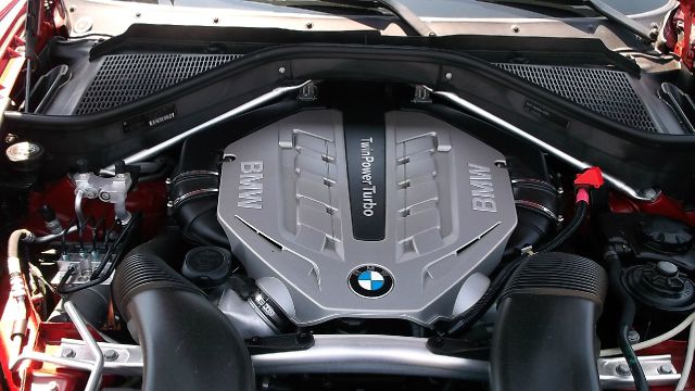 2011 BMW X6 1999 Toyota LE