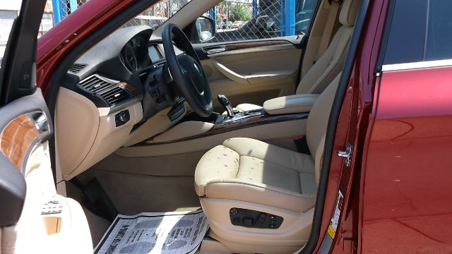 2011 BMW X6 1999 Toyota LE