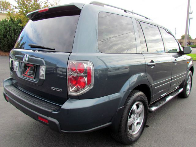 2006 Honda Pilot 2010 Cadillac CTS