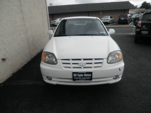 2003 Hyundai Accent 2000 Dodge SLT