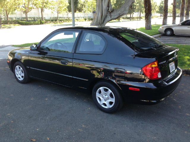 2004 Hyundai Accent 2000 Dodge SLT