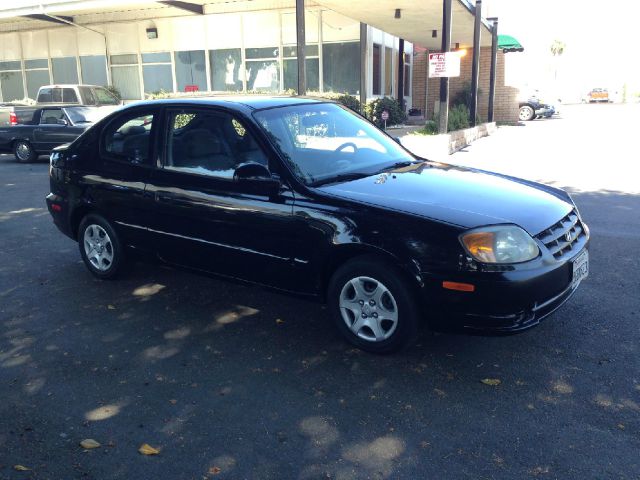 2004 Hyundai Accent 2000 Dodge SLT