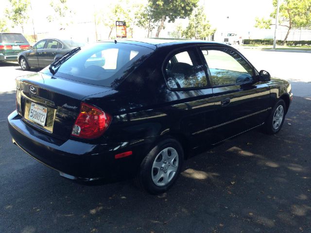 2004 Hyundai Accent 2000 Dodge SLT