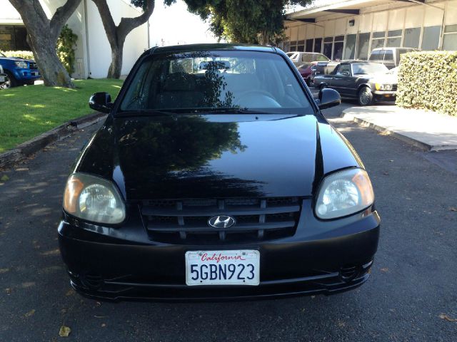 2004 Hyundai Accent 2000 Dodge SLT