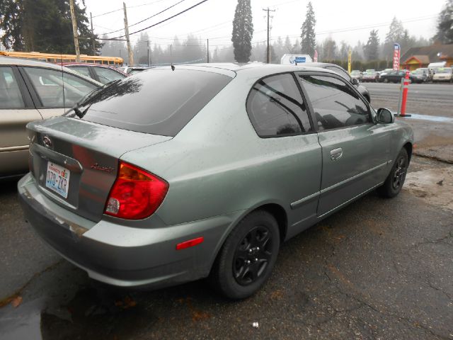 2004 Hyundai Accent 2000 Dodge SLT