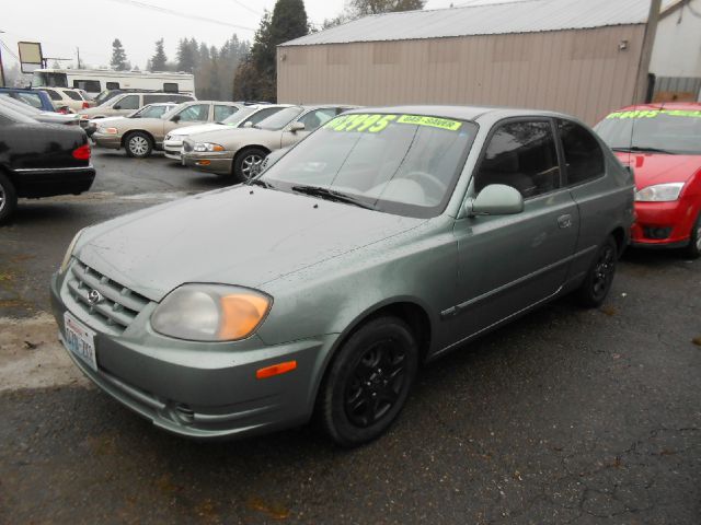 2004 Hyundai Accent 2000 Dodge SLT