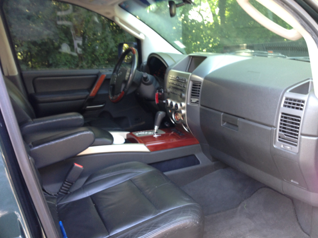 2004 Infiniti QX56 2007 Mazda Mazda3 S Grand Touring