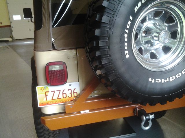 1983 Jeep Scrambler CJ8 2010 Cadillac CTS